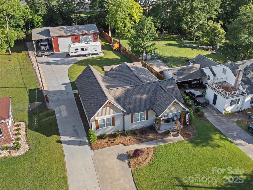 Prepare for an experience like you have never seen, the custom finishes provide a warm rustic flair w/ modern luxuries! The attention to detail fill every room! Across the threshold begin a breathtaking tour of this renovated home! Hardwood floors accent the main level living areas while sunlight spills through the picturesque windows that overlook the manicured yard! Prepare all your meals in the kitchen crafted for a culinary artist! Get cozy in the great room by the fire or retreat to the primary suite where rest and relaxation await! Also located inside are two more bedrooms, another full bath, laundry closet and expansive pantry!  Outside enjoy all four of our sweet southern seasons from the gorgeous covered patio! Tinker with your toys in the oversized 30x40 metal garage/workshop!  Fenced back yard and plenty of concrete parking for vehicles, campers and boats!  Award winning Clover schools and just a short distance to historic downtown Clover SC!