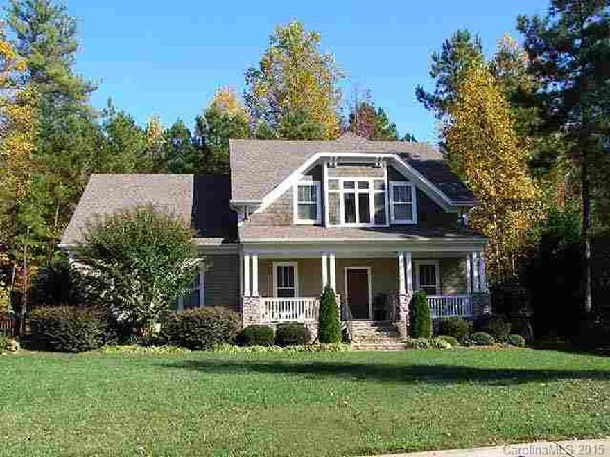Spacious Craftsman-style home in Lake Wylie's most desired neighborhood! Wonderful open floor plan features extensive HWs thru main level w/ tile in Kitchen/Breakfast, Half Bath & Laundry w/utility sink. Den/Office with french doors off foyer. Formal Dining framed by columns.  Kitchen has handy serving bar to the 2 story GR with fireplace. 1st floor Master accented by tray ceiling w/crown. Tons of storage space.  3 BRs + HUGE Bonus/Rec Room up. Extended  rear deck. Private, fenced backyard.