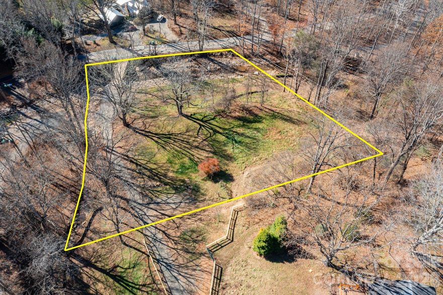 Situated on 1.1 level acres in highly desirable Weaverville just off Reems Creek Road, this beautiful homesite offers the rare advantage of dual creek frontage, creating a peaceful, park-like setting ideal for enjoying the sights and sounds of nature. As part of the Fiori Retreats community vision, the buyer will partner with Heavenly Homes—one of Houston’s most respected luxury builders, now expanding into North Carolina—to design and build a custom residence. Renowned for their high-end finishes, sophisticated architectural details, and thoughtfully crafted floor plans, Heavenly Homes will work closely with the buyer to create a home that seamlessly blends luxury living with the tranquility of its mountain surroundings.