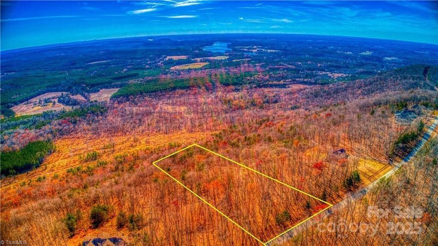 Welcome to 1644 Sierra Trace, a remarkable 5.23-acre parcel nestled in The Springs gated community. Enjoy seasonal vistas of Tuckertown Reservoir and Uwharrie Mountains, offering a picturesque backdrop for your dream home. The Springs features amenities like a Club House, pool, hot tub, and tennis/pickleball courts, all positioned to maximize views of High Rock Lake. Additional conveniences include boat/RV storage, a community boat ramp, day boat slips, and underground utilities. With the freedom to bring your own architectural plans and builder, you have the opportunity to craft a residence tailored to your unique vision, perfectly complementing the natural splendor of the community. Please note that access to the community requires the presence of a licensed agent at all times, underscoring our commitment to maintaining the utmost standards of privacy and security.