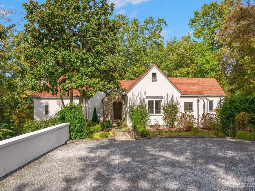 Back on the Market..No fault of the seller, or property!  Discover scenic views and landscaped grounds as you travel up the tree-lined drive, leading to a private paradise where nature meets art. Feast your eyes on a beautiful home, called "Windover", constructed by craftsmen who also contributed to the building of Biltmore House in Asheville. The world-renowned Ludiwici terracotta roof sets off the grounds, while the saltwater pool provides relaxing elegance. Light streams into the heart of the home, bringing 
out the peaceful retreat's details and touches from famous previous owners such as a best-selling New York Times author, sculptors, and craftsmen, all lending their artistic inspiration.
Primary Bedroom has secondary ingress (you can get to it either from inside house, or from exterior entry!