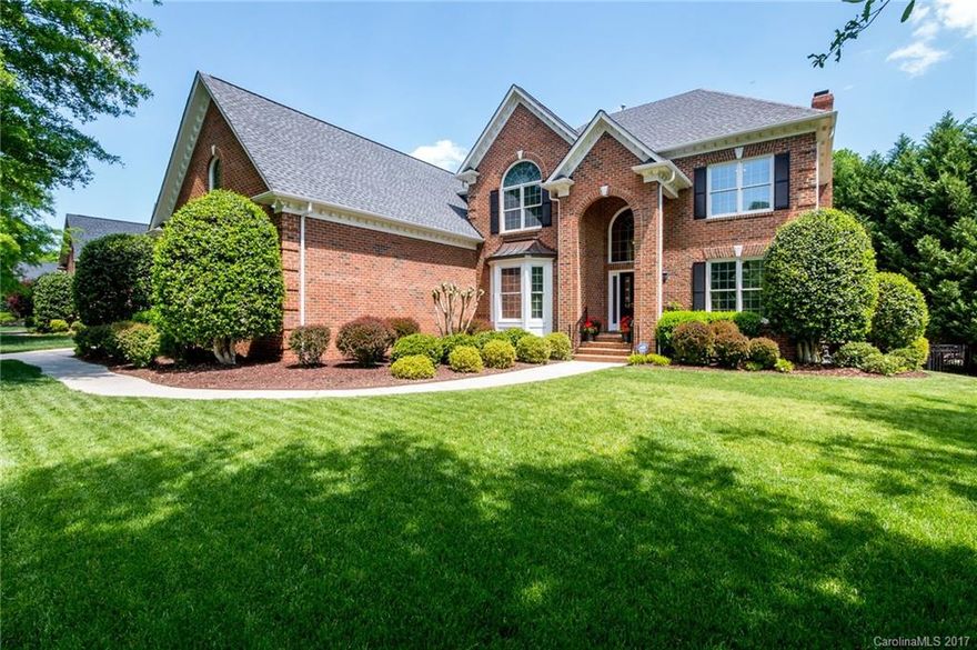 Beautiful 2 story brick home that features a 2 story foyer, 9 ft ceilings up and down, beautiful hardwoods, an updated kitchen with granite countertops and island and Master bedroom on the main. Dual staircases lead you to upper level with 3 spacious bedrooms, bonus room and a separate flex room. Home has a 3 car side load garage, private fenced in rear yard and full yard irrigation. PCC has a pool, tennis courts, restaurant and golf course and is a min from Blakeney and Waverly Shopping.