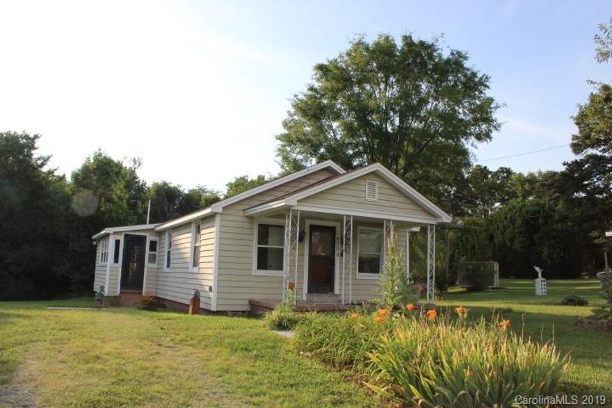 Great location! Half acre level yard. Covered front porch ,  nice size kitchen.  Lot has been Sub-divided. 2 bedroom 1 bath, Convenient to 485, I85, I77, White water center , Downtown, Shopping, Restaurants, Hospital, Tax records show 9349 Lawing School rd Per seller-. Property on a shared well, but has a well on property. City water and sewer at street per city.