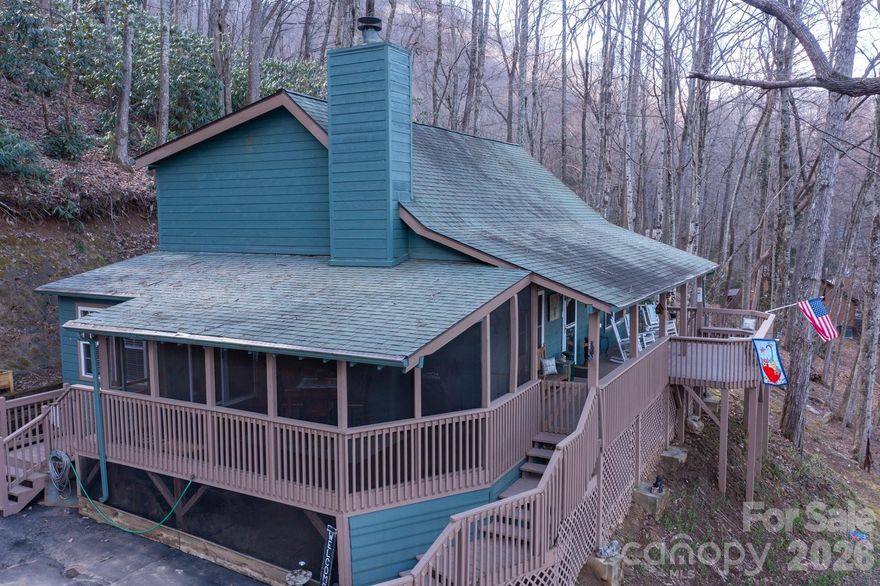 Discover your ultimate mountain retreat at 46 Hummingbird Dr, perfectly situated in the heart of the Smoky Mountains. This meticulously maintained 3-bedroom, 2-bath residence offers a blend of tranquility, comfort, and awe-inspiring natural beauty that buyers dream of finding in Maggie Valley.

Prepare to be captivated the moment you arrive. The expansive front deck serves as your private observatory, offering sensational, long-range mountain views that paint a different masterpiece with every season. Whether you are sipping morning coffee as the mist rises over the peaks or hosting an evening gathering under a canopy of stars, this outdoor space is the true crown jewel of the property.

Beyond the front deck, retreat to the large, private screened-in porch at the end of the home near the carport. This serene "outdoor room" offers a pest-free environment to enjoy the fresh mountain air, listen to the sounds of nature, and unwind in complete privacy.

Step inside to an open living area designed for relaxation. The space is anchored by a charming gas fireplace featuring a stone surround and a wood mantel—the perfect focal point for cozying up on chilly mountain evenings. The layout flows seamlessly into the dining area and kitchen, creating an ideal environment for entertaining.

The home has three bedrooms and two baths. The bedroom on the main level offers a peaceful sanctuary and single level living. While the bath is not an en suite, it is right out the bedroom door and has a newly renovated shower. Laundry is inside this bathroom.

This home offers the best of both worlds: a secluded mountain feel just minutes from the paved convenience of Soco Road and total paved access, including the driveway which is steep. You are perfectly positioned to enjoy everything the area has to offer, from the slopes of Cataloochee Ski Area and the fairways of the Maggie Valley Club to the endless hiking trails of the Great Smoky Mountains National Park and the unique shops and dining of downtown Maggie Valley and Waynesville.

Don’t miss this rare opportunity to own a piece of paradise where the views go on forever. Schedule your private showing at 46 Hummingbird Dr today and start living the life you’ve imagined!