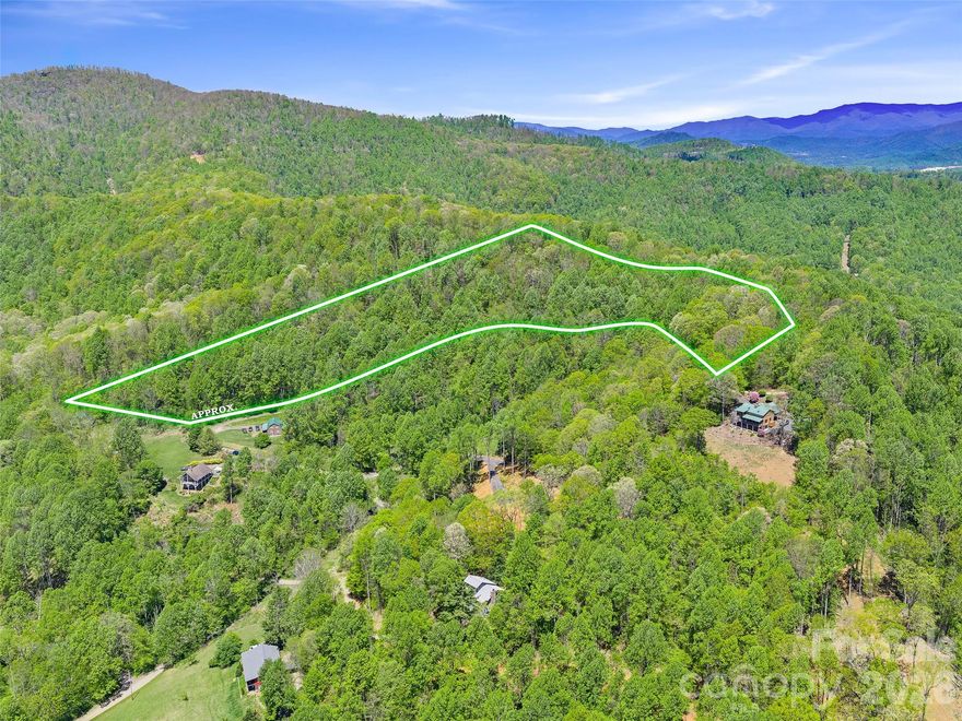 Tucked within the desirable Hollydale Development just off Dale Road in Spruce Pine, this 7.65-acre tract offers a rare opportunity to create your ideal mountain retreat, family compound, or investment project. With gentle to steep terrain and multiple potential build sites, the property lends itself beautifully to a variety of visions—from a private estate to thoughtfully divided lots.

With some strategic clearing, you could unlock stunning mountain views, elevating both the experience and value of the land. A road is already in place, providing easy access to the property, and the ability to connect to the community water system adds convenience and flexibility for future development.

Perfectly positioned just 10 minutes from the entrance to the Blue Ridge Parkway, you’ll enjoy quick access to one of the most scenic drives in the country, while still being only about an hour from the vibrant culture, dining, and amenities of Asheville.

Whether you’re looking to build, invest, or simply own a piece of Western North Carolina’s natural beauty, this property offers the space, location, and potential to bring your vision to life.