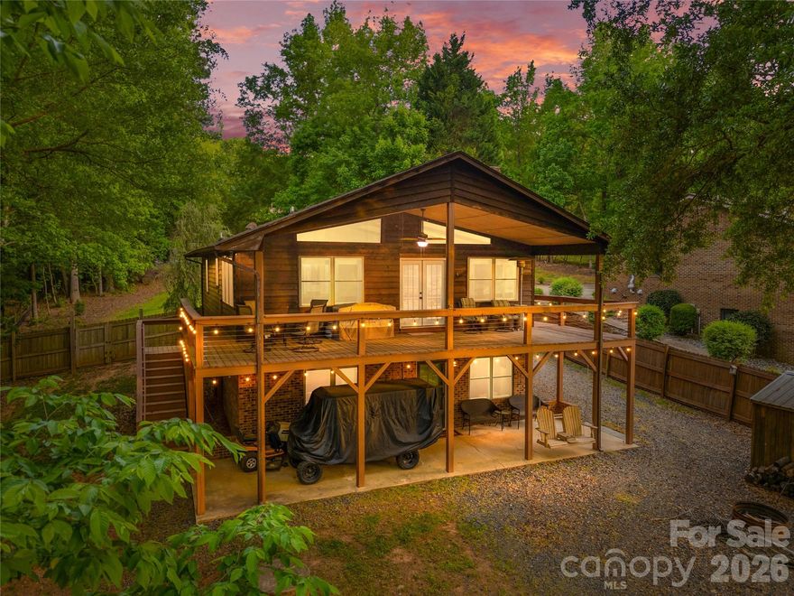 Lakefront living on the main channel of Lake Tillery with a direct view of Morrow Mountain State Park. This 4-bedroom, 3-bath home is located in the gated Carolina Forest community on Lake Tillery and offers wide water views and easy access to outdoor recreation.

The main level features an open great room, kitchen, and dining area with cathedral ceiling and many windows that highlight the lake and mountain views. The layout is functional and comfortable for everyday living or hosting guests. Both main-level bedrooms include en suite bathrooms, providing convenience and privacy. Two additional bedrooms in the basement and a third full bath offer flexible space for family, visitors, or office use.

Carolina Forest residents enjoy a range of amenities including a community boat ramp, outdoor pool with lake views, playground, tennis court, and basketball court. The home is conveniently located near Uwharrie National Forest and the towns of Troy, Mount Gilead, and Norwood, offering a balance of outdoor recreation and small-town charm.

Don't miss this well-located Lake Tillery property with phenomenal views and a fantastic layout.