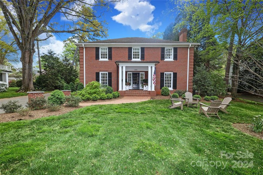 Beautiful classic home w/ an ageless layout abounds w/ charm in the heart of Charlotte! To add to the charm, the home is near the end of a cul de sac in a neighborhood w/ no cut thru streets. Home displays hardwood floors, a cozy Den & a large Living Room, both w/ wood burning fireplaces. Kitchen is adjacent to a covered porch & has a large island, walk-in pantry, beautiful painted cabinetry, stainless appliances & breakfast area. Kitchen opens to   Family Room flooded by natural light & an intimate Dining Room that is a perfect place for entertaining! Family Room opens to an inviting large Screened Porch & Patio. 5 large Bedrooms w/ 3 Bathrooms & a Screened Porch off Primary Bedroom are on 2nd floor level. Heated & cooled Basement w/ interior stairs offers many options.  Exterior presents 2 screened Porches, a brick Patio w/ Fire Pit & a flat .55 acre lot w/ amazing landscaping. 2 car Carport w/ Storage Area. Expansive driveway area provides great areas for outdoor fun! Home is a gem!