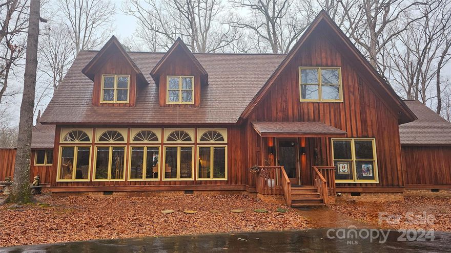 Run don't walk to check out this custom Creekside beauty. One of a kind, fine Redwood home located in a quaint neighborhood with no HOA.  Attractive inside and out you wont find another one like it. Gleaming wide plank floors in all the main living areas of the downstairs, Pallidum windows line the sunroom walls , You have a massive 2 story Great room with a stone fireplace and stunning cathedral ceiling with exposed beams. Large deck off the great room overlooks the creek. Kitchen has new appliances and fresh granite counter tops as well as the bathrooms. Upstairs has all new padding and carpet, as well as the downstairs primary bedroom.