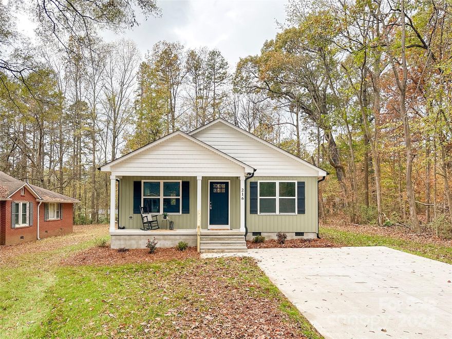 Local Custom Builder!!! Don't let this Completed New Construction Gorgeous, one story, 3 Bedroom, 2 Bath home with covered front porch and back deck slip by! Open floor plan w/den, dining & kitchen together. Recessed lighting throughout. Beautiful kitchen with white shaker style cabinets (soft close doors & drawers), subway tile backsplash, large island with storage, and grey granite countertops. New stainless-steel appliances! Enjoy privacy in the Master Suite, which boasts dual vanities with beautiful custom tile shower. Brushed nickel fixtures throughout home. Energy efficient electric with Duke Energy. Wood colored LVP flooring thru the entire home including bedrooms, no carpet! Large lot with wooded privacy on one side. Back deck and large front porch.  Convenient to I85 and easy commute into Charlotte.  Area has several new construction and remodeled homes!