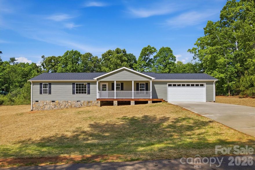 Welcome to 4915 St. Clark Rd in Morganton—a brand-new construction home completed in 2026, offering modern style, quality craftsmanship, and energy-efficient living on a semi-private 1.09-acre lot.

Step inside to discover a bright, open-concept layout designed for today’s lifestyle. The spacious living, dining, and kitchen areas flow seamlessly together, creating the perfect setting for everyday living and entertaining. The kitchen shines with granite countertops, stainless steel appliances—including a side-by-side refrigerator, smooth-top range, dishwasher, and microwave—plus sleek finishes throughout.

This thoughtfully designed home features 3 bedrooms and 2 full baths, all on one level for easy living. The primary suite offers a ceiling fan, an additional closet for extra storage, and a private bath complete with a walk-in shower and walk-in closet. The guest bath includes a convenient tub/shower combination.

Enjoy outdoor living with a welcoming covered front porch, a rear deck ideal for relaxing or grilling, and both front and backyard space to spread out and enjoy your surroundings.

Additional highlights include:

Oversized garage with ample storage or workspace
Large laundry room for added convenience
Low-maintenance vinyl siding
Architectural shingle roof
Wide concrete driveway
Recessed lighting, brushed nickel & chrome fixtures throughout
Energy-efficient Carrier heat pump with central air

If you’re looking for a move-in-ready home with modern finishes, privacy, and room to breathe—this one checks all the boxes. Don’t miss your opportunity to own this beautiful new build!

Owner is a licensed real estate broker.