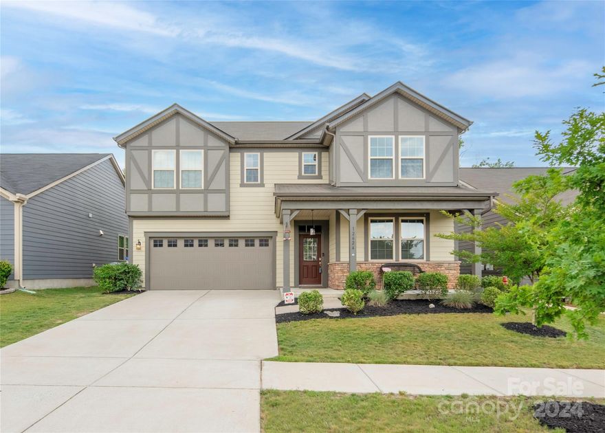 Welcome to this stunning five-bedroom, three-bathroom home in the desirable Magnolia Walk neighborhood. This spacious property features a beautiful fenced-in yard and covered porch to enjoy your morning coffee overlooking the pocket park. Inside, you'll find a well-designed layout with additional loft area and full bathroom and bedroom on main. The kitchen features a huge pantry that wraps around under the steps, providing ample storage as well as Gladiator brand storage in the garage. The separate part of the house dedicated to the primary suite and bathroom offers a private retreat away from the other bedrooms. With a walking path to HFFA, fitness and recreation are just steps away. The property is also just minutes away from major highways such as 485 and I-77, providing easy access to Charlotte and other destinations. Additionally, you'll find a variety of restaurants and grocery stores in close proximity, making every day errands a breeze.