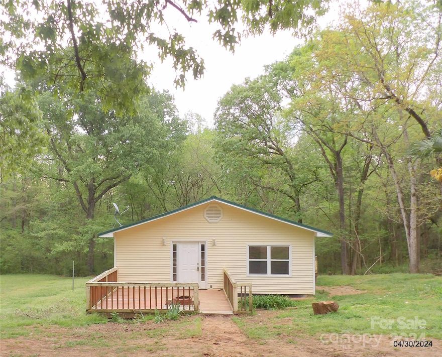 Minutes from Hwy 521 and an easy commute to Charlotte, NC.  Investor opportunity for fix and flip or rental property.  Cash only due to a singlewide mobile home with addition. The mobile home is a 1969 and the addition was added in around 2000. The lot is cleared around home and garden area.  The other 4 acre +/- is wooded and private.   Second bath has been stripped but has been plumbed. Bring your hammer but a little hard work will pay off with a wonderful home!