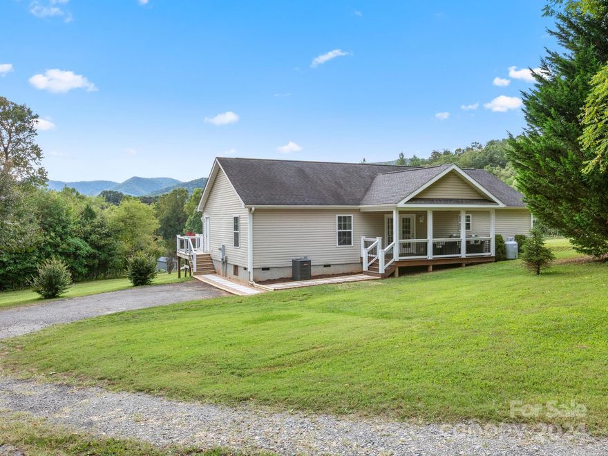 It's evident right off that this home has been well maintained and in great condition. The location and setting are just as nice with plenty of yard space and fantastic long range mountain views. The covered porch is so inviting and offers the perfect space to spend time outdoors. Inside the home you will find an open floor plan and views from almost every room. The kitchen is well appointed with an island and under-cabinet lighting. The living room is generous in size with gas logs for those cooler fall and winter days. The primary bathroom has been recently upgraded offering a clean and contemporary feeling that would rival any high end custom home. The upstairs attic spans the entire length of the home and provides ample storage.  Outside there is a utility building and fire pit. The heat pump was replaced 3-4 years ago. The owners recently freshened up the landscaping with mulch and new sidewalks. New handrails and pickets on the back porch to match the front. Some interior paint.