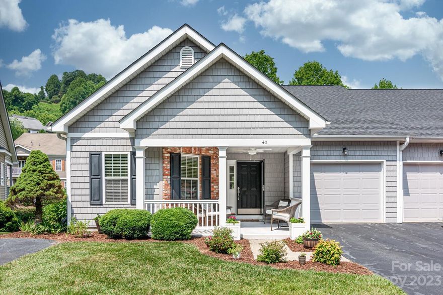 Move-In-Ready, recently updated with wood floors, new appliances and fresh paint.  Open floor plan, light filled, and split bedroom plan.  Sitting front porch and screened rear upper patio.  Primary Suite and bedroom / office on Main level, with two large guest rooms on the lower level with their own den and patio. Convenient to Laurel Park shopping and the new Ecusta Trail  now under construction.  One road into the neighborhood with great walking throughout the friendly neighborhood.