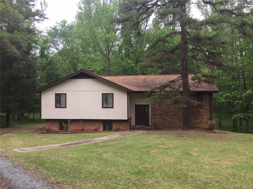 Private location in desirable Black Horse Run, close to everything! Split level home on wooded acreage. Inside is open Living - Dining space with nice pre-finished wood floors. Charming knotty pine cabinetry in kitchen. Three bedrooms up with an ensuite bath off master as well as sliding doors onto the rear deck. Lower level is a large den with fireplace, another bedroom option and plenty of storage. Oversized one car Garage is in lower level, with rear entry.