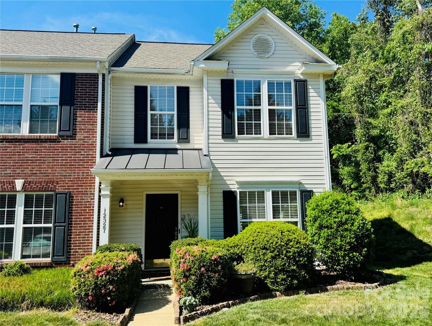 MOVE-IN READY! NEW PRICE! Welcome to this stunning corner-unit townhome tucked at the end of a peaceful cul-de-sac! Surrounded by lush landscaping, this home greets you with pristine white vinyl siding that has just been professionally pressure-washed for a crisp, inviting look. The private patio offers the perfect setting for morning coffee, weekend entertaining, or bird-watching in your tranquil retreat. Beyond the privacy fence, a beautifully maintained common area opens to a tree-lined view—providing extra peace and space rarely found in townhome living. Inside, every inch of this home has been lovingly curated and thoughtfully improved. Enjoy brand-new luxury vinyl plank flooring throughout the main level and both upstairs bathrooms, paired with new plush carpet featuring premium rebound padding underfoot for a soft, comfortable feel. The entire interior has been freshly painted from ceiling to baseboards in neutral designer tones, ready for your personal style and décor. The kitchen has been elevated with refinished cabinetry in a sophisticated hue called Okra, highlighted by burnished bronze hardware that beautifully contrasts against the countertops. Lighting throughout the home was chosen with care, featuring updated fixtures that enhance each space. The true showstopper is the Arteriors “Ramirez” brass and glass chandelier—a striking centerpiece in the dining area that adds warmth and modern elegance. Upstairs, the primary suite is spacious and serene with a tray ceiling, generous walk-in closet, and a relaxing en-suite bath complete with dual vanity space and an oversized garden soaking tub—your private at-home spa. Two additional bedrooms offer roomy closets and share a beautifully refreshed full bath. The soaking tub in the primary and the tub in the shared bathroom have been professionally reglazed, giving them a fresh, like-new appearance. This home combines thoughtful design, modern updates, and a private natural setting—creating a rare find that’s both stylish and move-in ready. Located near shopping, dining, and everyday conveniences, this community also features a sparkling pool, beautifully landscaped common areas, and wide streets ideal for evening walks or morning jogs. Schedule your showing today and experience the perfect blend of comfort, charm, and convenience! This could be your next home!