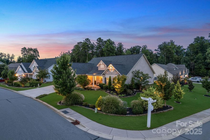 Prepare to be wowed as you arrive at this beautiful home boasting the most stunning curb appeal. Step inside this semi-custom home featuring a showstopping kitchen, relaxing great room w/ stone fireplace, & spacious primary suite. At the entry, you’ll find a private office w/ custom built-ins, enclosed for quiet focus. The heart of the home includes hardwood floors, an expansive island w/ new granite countertops, freshly painted cabinets, a new undermount sink w/ touch faucet & instant hot water. The dining area showcases a coffered ceiling & sliding doors to your outdoor oasis: a covered patio w/ epoxied floor, motorized blinds, & extensive hardscape for dining al fresco, cozying up to the fire pit, or enjoying the spa. With one of the largest lots in the community & a fenced backyard, there’s plenty of space to entertain or let your furry friends run free. Enjoy an extended garage w/ custom built-ins & epoxied floor. Downsizing doesn't mean downgrading & this home proves it!