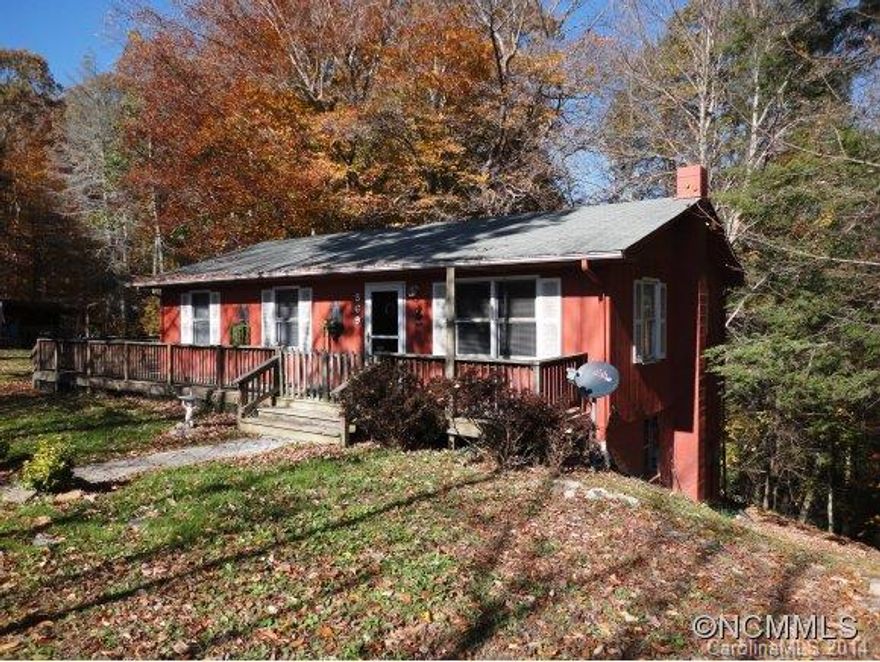Very private and beautiful setting. 1.65 acres, partially wooded and completely lovely! Home has 2 bdrms and 2 baths, eat in kitchen, large master bedroom and partially finished basement with wood stove and bar. Wrap around deck, new shed, and long range mountain views on the drive in! This charming haven is just minutes from the historic town of Marshall and about 25 minutes to downtown Asheville. Come find your mountain hideaway right here!