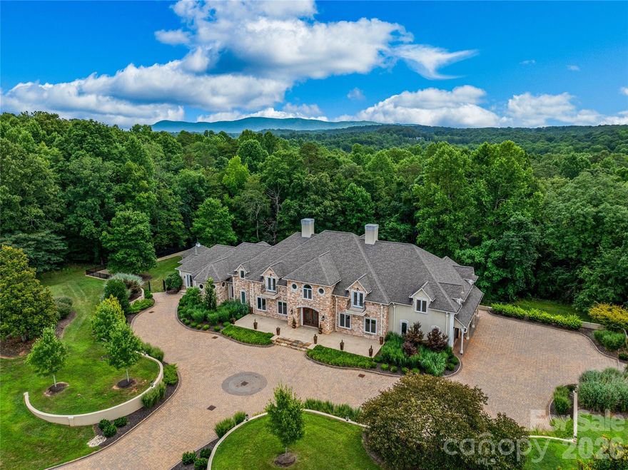 Experience exceptional craftsmanship, refined luxury, and expansive living spaces at this truly one-of-a-kind property. A striking brick paver driveway, framed by meticulously maintained landscaping, creates a memorable approach to the home.

Designed with entertaining in mind, the main level features a spacious great room with a custom library, a welcoming family room, a dining area, and a well-appointed chef’s kitchen offering abundant storage. Access the upper level by way of the grand curved staircase or private elevator, where the primary suite and additional bedrooms await.

The primary suite offers a private covered balcony and a luxurious bath complete with a steam shower, soaking tub, walk-in closet, wet bar, and dedicated laundry area. The lower level expands the home’s versatility with additional finished spaces, including a full kitchen, living area, bonus rooms, and a full bath.

Set on approximately 27 acres, the property provides complete privacy, open land, and opportunities to establish pastures. Altogether, this home represents a rare combination of quality construction, timeless character, and a thoughtfully designed floor plan, offering exceptional value in today’s market.