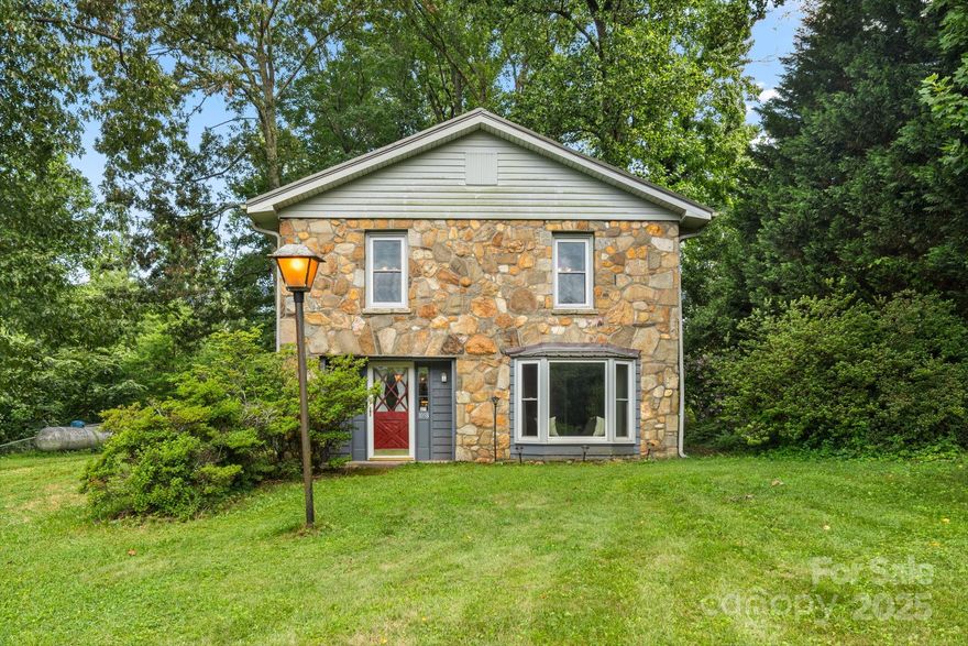 Tucked away on 0.84 acres of gently sloping land, this classic 1950s stone home offers the timeless charm of yesteryear, complemented by the comfort and updates of today. Free from HOA fees, you’ll enjoy the freedom to live how you choose. The fully fenced backyard is a peaceful, tree-lined retreat—perfect for pets, play, gardening, or simply enjoying the privacy nature provides.

Inside, you’ll find a lovingly maintained home featuring three spacious bedrooms, two full baths, and a convenient half bath. Thoughtfully updated bathrooms, insulated windows, and a brand-new propane boiler heating system ensure year-round comfort. Window air conditioning units provide personalized cooling in the warmer months.

Whether you're relaxing indoors or taking in the serenity of the backyard, this property offers the kind of quiet, flexible living that’s hard to find. Need storage? This property offers two storage buildings.