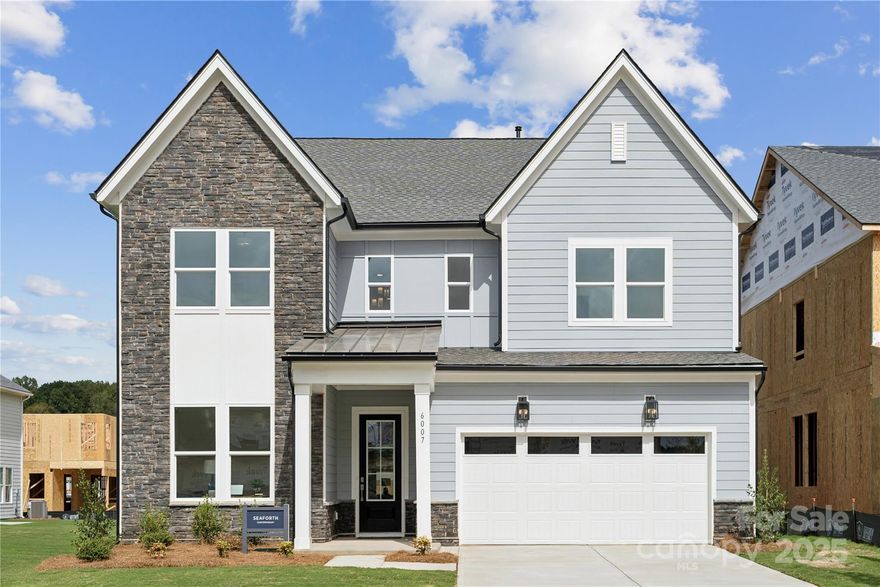 Introducing a truly one-of-a-kind residence in Griffith Lakes—originally crafted as a showcase home for our newest luxury community. Every detail has been thoughtfully curated and impeccably finished, offering a rare chance to own the only gallery home of its kind in our community. This is an unparalleled opportunity to secure a model-caliber residence in one of Charlotte’s most sought-after new neighborhoods.

Step into elevated style and comfort in The Seaforth, a striking home designed with thoughtful details and refined craftsmanship throughout. This beautifully appointed residence welcomes you with a dramatic two-story foyer, setting the tone for the modern elegance found in every space.

The main living area features stunning herringbone-style flooring, creating a warm, upscale foundation that flows seamlessly through the open-concept layout. The gourmet kitchen is a true centerpiece, showcasing an extended island with rich navy cabinetry, sleek Whirlpool appliances, and ample workspace ideal for cooking and entertaining alike.

The spacious great room is anchored by a modern linear fireplace, offering both ambiance and architectural appeal. Step outside to a comfortable covered rear porch, providing an ideal setting for year-round relaxation and outdoor dining.

The primary suite is designed for serenity and convenience featuring dual walk-in closets. Additional bedrooms and living spaces offer flexibility for family, guests, or a home office.

With its contemporary design, high-end finishes, and functional layout, The Seaforth delivers the perfect blend of luxury and livability.

And that’s not all—future resort-style amenities are projected for completion in 2026, including a clubhouse, fitness center, outdoor pool with cabanas, hot tub, pickleball & tennis courts, bocce ball, grilling areas, and cozy firepits. This community is crafted for elevated living and endless enjoyment. This home truly has it all—luxury, convenience, and incredible incentives. Don’t miss your chance to make it yours!