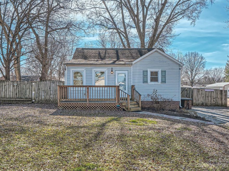 Discover the perfect blend of comfort & style in this charming one-story residence. Boasting 2 BRs & 1 BA, this freshly painted home is a true gem. Step inside to experience the allure of new vinyl plank flooring that graces most of the living spaces. The heart of the home shines with a kitchen featuring stainless steel appliances & tile backsplash. Whether you're a culinary enthusiast or just love a sleek and functional space, this kitchen is sure to impress. The bathroom has received a contemporary makeover, adding a touch of luxury to your daily routine. Comfy living room w/ brick fireplace & decorative wood mantel. The sunroom has tile flooring & makes for a perfect dining area, sitting area, or office. The fenced backyard is a private oasis, complete with a wired storage building & wired one-car garage. Entertain guests on the expansive custom patio, perfect for enjoying the pleasant Kannapolis weather. This home is not just a dwelling; it's a sanctuary where memories are made.
