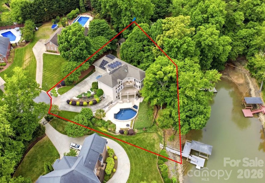 Wake up to shimmering water views and end your evenings with sunset reflections over Lake Wylie. This freshly updated and professionally staged custom home offers five bedrooms, 4.5 baths, and a striking modern art deco design filled with light from soaring ceilings and dramatic walls of windows.
Whether you’re hosting friends or enjoying a quiet weekend, this home delivers—chef’s kitchen, walkout basement with media room, expansive terraces, and a resort-style heated saltwater pool with outdoor kitchen.
A rare blend of luxury, comfort, and location—just a short bike ride to downtown Belmont.