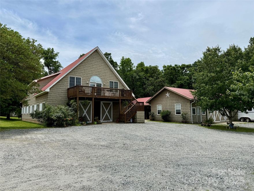 This desirable horse facility w/ deeded CETA trails is located in the heart of horse country in Polk County & close to Tryon! Barndominium with center aisle barn includes eight 12x12 stalls, wash stall, fly spray system, a dedicated tack room for boarders, and a separate owner's tack room w/ full bath & laundry all on the main level. The upper level reveals a breathtaking 3BR/2BA ~2900sqft owner's home. Soaring ceilings and an elegant open floor plan await you. A second barn complements the main barn. It has 4 additional stalls (convertible into broodmare stalls), 3 wash racks, a dry-grooming area, tack room, tool room, blanket storage, shavings storage room, hay storage room, and an office/break room that could easily be converted into a small apartment. Covered large dressage arena, plus a 100x200 outdoor arena & lunge ring perfect for hunter/jumpers. Eight paddocks with dividing lanes. RV pad w/ septic hook-up. Entire perimeter is fenced. 6.4 miles to TIEC!