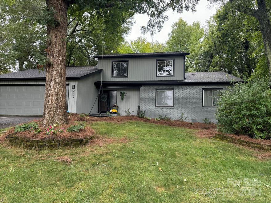 2309 Lynbridge Drive is a charming one and a half story home in the Hampton Leas neighborhood. So close to restaurants, shops and entrance to greenway. This unique home has vaulted ceilings in the primary bedroom and family room. Primary bedroom on the main floor has sliding glass doors that open to an owners private deck retreat.  Lots of outside living at this home with a second large deck and patio just outside the family room and kitchen. The large glass doors fill the room with loads of light and offer views of the large private back yard. Spacious kitchen and dining space has a built in bar / coffee station. Family room has beautiful tall built in bookcases. Upstairs hosts 3 bedrooms and full bathroom. This home is one NOT to be missed!