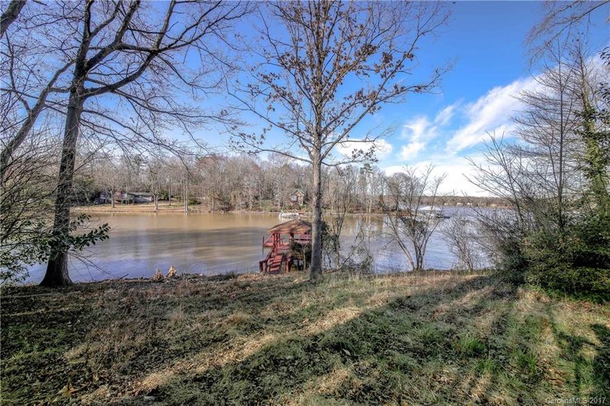 Beautiful waterfront lot in Heron Cove in the Lake Wylie. This deep water, elevated lot is the perfect place to build your dream house! There is a large well maintained dock in place and ready for your boat. The expansive lot has great main channel views and well suited for a basement or crawl space home. Low taxes, Clover schools and a short commute to the Charlotte area. Bring your own builder. Lot 59 6934 Pine Moss Lane is also for sale