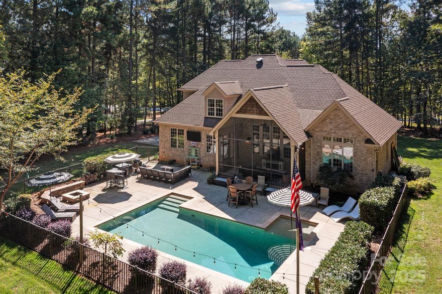 Welcome to this stunning custom stone and brick home, nestled on a spacious 1.3-acre lot in the coveted gated community of Pebble Bay. Designed with comfort and functionality in mind, this home offers a seamless open layout with custom details like vaulted ceilings, a stone fireplace and custom gunite saltwater pool.   At the heart of the home you’ll find an updated kitchen with gas cook top, double ovens and a large kitchen island that flows seamlessly into the vaulted family room, complete with a cozy fireplace and beautiful built ins with floating shelves and views of the pool.  The main level office can be utilized as a guest suite and offers privacy from the main living area. The luxurious main level primary suite leads to a beautifully updated bath with stand alone tub, new tile flooring and shower. Upstairs, you’ll find three generously sized bedrooms, a full bath, and a large loft sitting area that overlooks the family room below, creating an open and inviting atmosphere. Outdoor living is equally impressive with a spacious screened porch, perfect for year-round enjoyment, leading to a private backyard oasis. The in-ground saltwater heated pool, fire pit, and abundant space for entertaining make this home ideal for gatherings with family and friends.This property combines privacy, elegance, and modern updates—all within a sought-after Lake Norman community. Don’t miss the opportunity to make this Pebble Bay beauty your new home.