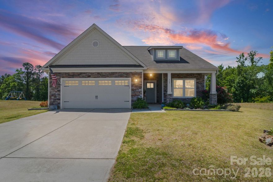 Welcome to 715 Lexington Drive in the desirable Grandview community of Albemarle!
Built in 2020, this thoughtfully designed home offers the perfect blend of modern style, functional space, and everyday comfort in a convenient Stanly County location.

Step inside to discover a spacious open-concept floor plan featuring a bright living area that flows seamlessly into the kitchen and dining spaces—ideal for both daily living and entertaining. The kitchen is well-appointed with granite countertops, tile backsplash, and ample cabinetry, while luxury vinyl plank flooring enhances the main living areas with both durability and style.

The primary bedroom on the main level provides convenience and privacy, complemented by a split-bedroom design with additional bedrooms thoughtfully positioned. In total, the home offers 4 bedrooms and 3 full bathrooms, providing flexible space for a variety of needs. Upstairs, a generous loft/flex area adds versatility—perfect for a media room, home office, or additional living space.

With approximately 1,700 square feet on the main level and 688 square feet upstairs, plus a spacious 450 square foot garage, this home delivers both comfort and practicality. Outside, enjoy a low-maintenance vinyl exterior and established landscaping that enhances curb appeal.

Located in the Grandview subdivision, residents appreciate a setting that balances peaceful surroundings with accessibility. The community is situated along the Hwy 24/27 corridor, offering convenient access to shopping, dining, and everyday amenities, while still being close to outdoor recreation and the natural beauty of the region.

Move-in ready and meticulously maintained, this home is ready for its next chapter. Schedule your showing today and experience all that 715 Lexington Drive has to offer!

Utility Easement along the left property line.  Garden and Rear Yard Fence are temporary and do not convey.