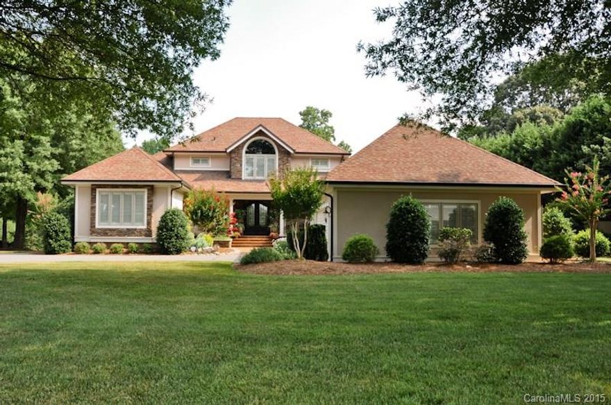 STUNNING Renovation to this home on corner lot in Rock Barn Golf & Spa development. Seller added stonework all along the home, new doors, windows, paint, landscaping on this sprawling lot. Exquisite iron front, double doors. As you enter refinished hardwoods, custom crown molding, elegant staircase. State of the art kitchen, new cabinets, granite counters, 6 burner gas Viking stove w/copper hood, warming drawer, dbl Thermador ovens, Bosch dishwasher + mini dishwasher, copper sink, wine rack.