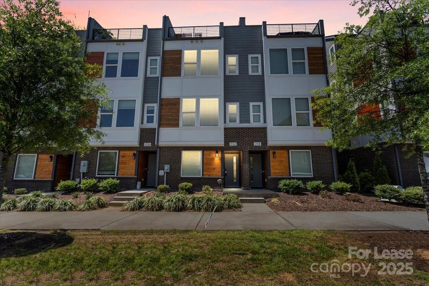 Location! Location! Location! Enjoy the AMAZING VIEWS of the Charlotte Skyline from the comforts of your own personal rooftop terrace! This like-new townhome features upscale finishes incl 5-inch plank hardwood floors, quartz countertops, stainless steel appliances, distinctive lighting and more. Stackable Washer & Dryer are also for resident's personal use. Located in the heart of Charlotte’s dynamic FreeMoreWest neighborhood, this townhome is also adjacent to the new Salt & Vinegar Mixed Use Development featuring Legion Brewery, and within walking distance of dozens of restaurants and shops along West Morehead that is <1 mile from beautiful Uptown Charlotte. Run, Walk, Bike out the Stewart and Irwin Creek greenways and then relax at Bryant Neighborhood Park, right next door. Entertain from your personal rooftop terrace with stunning city views and easy access in and out of Uptown! Note: While listed as a 2 bedroom, Loft area could also possibly be used for an optional third bedroom.