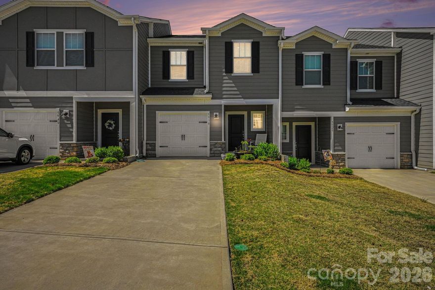 Better than new — and priced $23,000 below what Meritage is charging for comparable new construction nearby. This 2024-built Topaz townhome in the sold-out Georgetown Crossing community is move-in ready, energy-efficient, and loaded with the upgrades buyers are looking for.

THE HOME
Step into an open-concept main level designed for the way people actually live. The kitchen anchors the space with a center island, walk-in pantry, stainless appliances, and generous counter space — all flowing seamlessly into the dining area and great room. Prefinished wood floors run throughout the main level. A convenient drop zone off the garage keeps daily life organized, and a half bath rounds out the main floor.

Upstairs, the spacious primary suite features dual sinks and a walk-in closet. Two additional bedrooms share a full bath, and the laundry is conveniently located on the upper level — right where you need it.

THE UPGRADES
The attached one-car garage includes a professionally installed EV charger — a rare addition at this price point and a feature the original builder does not include as standard. Whether you drive electric today or are planning ahead, the infrastructure is already in place.

THE BUILD
Meritage builds to ENERGY STAR certification standards. The heat pump HVAC, fresh air ventilation system, and low-flow fixtures are engineered to reduce utility costs from day one — not a marketing claim, a measurable difference in monthly bills. Built in 2024 and owner-occupied since October 2024. Everything is essentially new.

THE COMMUNITY
Georgetown Crossing is a low-maintenance townhome community with HOA-managed exterior upkeep at low monthly cost, no yard work, no exterior repairs on your to-do list. Walkable to Cabarrus County schools. Quick I-85 access for an easy Charlotte commute. Surrounded by the shopping, dining, and entertainment of the Kannapolis-Concord corridor. The community is sold out. Meritage is not building here anymore.

THE CITY
Kannapolis is in the middle of a documented, funded transformation: a $500M development around the NC Research Campus, a new Novant Health hospital coming by 2030, the Millstone Village mixed-use project underway with a Harris Teeter and 400-plus residential units, and a growing downtown anchored by Atrium Health Ballpark and a thriving dining scene. Buyers who move now are ahead of the next wave of appreciation this market is building toward.

3 bed | 2.5 bath | 1,393 sq ft | 2024 build | EV charger | ENERGY STAR | $312,000