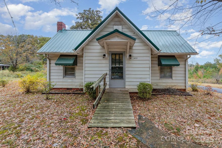 Discover this charming 3-bedroom, 1-bath single-family home nestled on a spacious one-acre lot in the peaceful community of Linwood. Built in 1939 and offering approximately 876 square feet of living space, this residence features timeless character and comfortable potential.

Step inside to a warm living area centered around a cozy fireplace, perfect for relaxing evenings. The floor plan includes three well-sized bedrooms and a full bathroom, complemented by a mix of hardwood, carpet, and vinyl flooring throughout. The kitchen and dining area are ready for your personal touches and offer an expansive palette for future updates. 

Outside, the expansive yard provides ample space for gardening, outdoor recreation, or future expansion. A covered carport offers convenient parking and additional storage options. The property’s location along South State Highway 150 offers easy access to local amenities, major routes, and nearby towns, blending the benefits of a quiet rural setting with everyday convenience.  The home and property present an excellent opportunity for a variety of buyers. Whether you’re seeking your first home, downsizing to enjoy more open space, or exploring an investment property, this Linwood address offers both potential and charm.

With just a bit of updating, you can transform this classic home into your ideal retreat. Don’t miss the chance to make it yours—schedule a showing today and experience all that this property has to offer.
