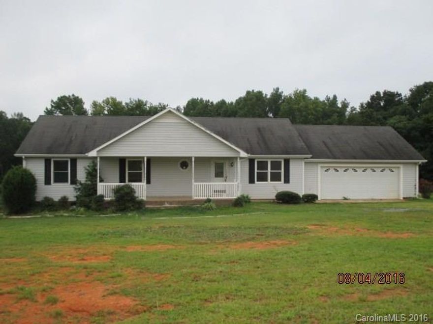 Single story home features 3 bedrooms, 2 bathrooms, breakfast, den, kitchen, living room, and bonus room. Features include ample kitchen cabinet spaces, porch, and deck. Home sits on 0.59 acre lot. Garage conversion was not permitted.