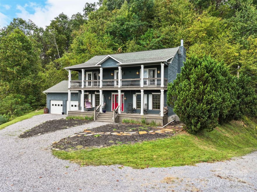 Within the serene embrace of this prestigious gated mountain subdivision in beautiful Haywood County, NC, this stunning two-story cedar wood-sided home offers an unparalleled blend of luxury, comfort, and breathtaking natural beauty. Perched atop a picturesque knoll in the heart of the Blue Ridge Mountains, this 2,170+ square foot residence boasts endless, long-range, year-round mountain views, with its south-facing orientation ensuring abundant natural light and captivating vistas from sunrise to sunset. Designed with sophistication and functionality in mind, this 4-bedroom, 2.5-bath home features an inviting open floor plan that seamlessly connects its thoughtfully crafted living spaces, making it ideal for both everyday living and entertaining. As you step inside, you’re greeted by a spacious great room, the heart of the home, where a cozy fireplace serves as a focal point, creating a warm and welcoming ambiance. The great room flows effortlessly into the dining room, perfect for hosting gatherings or intimate family dinners. The adjacent kitchen is a chef’s dream, bright and airy, featuring a large center island with a built-in cooktop and a convenient breakfast bar. Ample cabinetry, modern appliances, and expansive countertops make this kitchen as functional as it is stylish, catering to both casual meals and gourmet creations. Elegant crown molding throughout the main living areas adds a touch of refined craftsmanship, elevating the home’s aesthetic appeal. The expansive primary suite is a private retreat, offering generous space, serene mountain views, and a luxurious en-suite bathroom designed for relaxation. Three additional well-appointed bedrooms provide ample room for family, guests, or a home office, with a full bathroom and a convenient half-bath ensuring comfort and accessibility for all. The home’s thoughtful design extends outdoors, where a double covered front deck invites you to unwind while soaking in the panoramic mountain scenery—perfect for morning coffee, evening cocktails, or simply basking in the tranquility of the Blue Ridge Mountains. Practicality meets convenience with an attached double-car garage, providing ample storage and easy access. The cedar wood siding not only enhances the home’s rustic charm but also ensures durability in the mountain climate. Set within a secure, gated community, this property offers peace of mind and a sense of exclusivity, all while being surrounded by the natural splendor of Haywood County. Whether you’re seeking a year-round residence or a vacation escape, this home delivers an extraordinary lifestyle in one of North Carolina’s most coveted mountain settings. With its combination of modern amenities, elegant finishes, and awe-inspiring views, this mountain retreat is a rare find, ready to become your forever home.