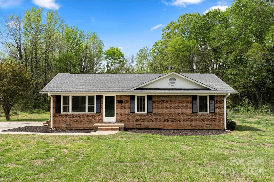 Situated on over a half-acre lot in desirable York, this full brick 3 bedroom home presents an excellent chance to infuse your unique style in this solid space. This home offers a modern touch featuring white kitchen cabinets and sleek surface countertops. With a generous level yard, there's potential to expand the living space or even install a pool. Don't delay an opportunity to make this space your home; schedule your showing today.