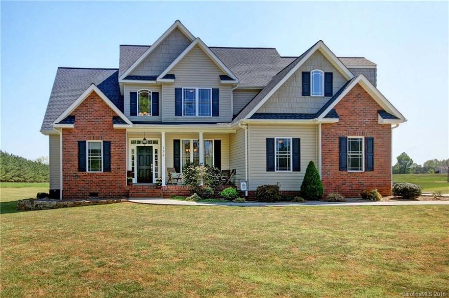 Charming two story home seated on a beautiful flat lot within a country setting. 1+ acre lot w/ additional detached 2 car garage, perfect for a work-shop or car enthusiast. Kit offers granite & ss appliances overlooking open great room, fireplace & breakfast. First floor has abundant windows & hardwood flooring. Master on main w/ tray ceiling, walk in closet, garden tub & separate shower & dual sinks. Unique area of homes is close to Lake Norman, Downtown Mooresville, Interstate & More. No HOA.