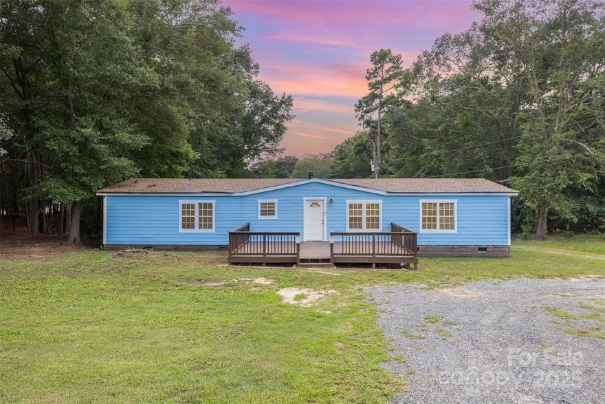 Completely updated manufactured home in Fort Mill with no HOA and access to top-rated schools. Recent improvements include a newer roof (2020), soffits, flashing (2021),  hardboard siding, as well as a new gas pack HVAC system with ductwork (2024) and a new tankless water heater. The interior features laminate flooring throughout, freshly painted walls, and fully updated primary bathroom with new double vanities, flooring, lighting and new toilets thoughout. The kitchen has new cabinets, laminate marbled counters, and 1-year-old stainless steel appliances. Additional highlights include a gas fireplace and recently stained front and back deck- making this a move-in ready home with modern updates throughout!