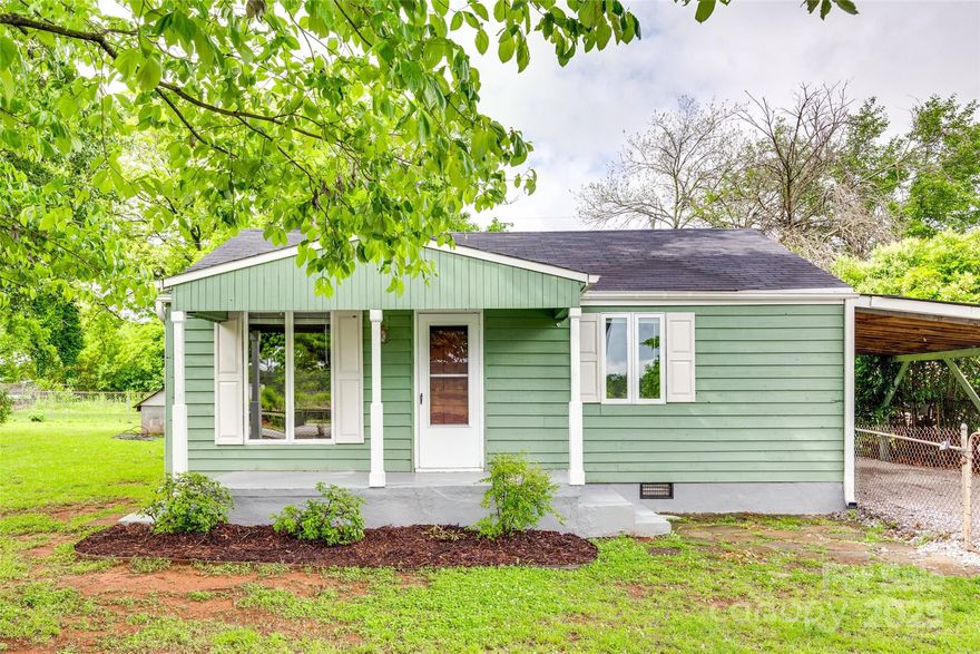 This super cute home sits on two combined lots and features an open floor plan with stylish vinyl plank flooring, white appliances, white cabinets, and neutral interior paint throughout. Enjoy outdoor living in the large, fenced-in backyard complete with a nice deck.With its cozy layout and smart use of space, this home is a great fit for first-time buyers, downsizers, or investors alike.