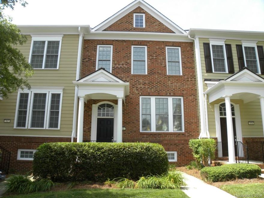 Premium unit includes: $5,000 premium lot, brick front elevation ($8,500), hardwood floors on entire first floor ($4,000) and wrought iron baluster handrails ($2,500).  Rare fantastic views of scenic wooded area from deck, kitchen and two rear bedrooms.  Best commute to downtown Charlotte and close to Lake Wylie and the Catawba river.