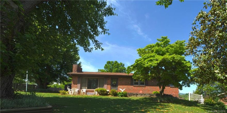 You've found it! The home you've always been looking for. A solid brick ranch that has been meticulously maintained by the seller. Kitchen has been updated with custom maple cabinets and solid surface counter tops. Enjoy the year round mountain views from the enclosed sun porch (not counted in Sq Ft due to ceiling height). Fantastic setting with a pristine lawn, low maintenance landscaping, and a large garden spot waiting for your spring vegetable plantings. 10 mins to UNCA, 15 mins to downtown