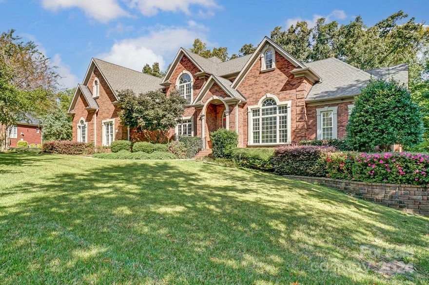 Come fall in love with this gorgeous custom built brick home in Laurel Creek. Too many features to list (see attached). Home sits on over 1/2 acre w private, wooded & fenced yard. There are up to 7 BRs & 5 BAs. Primary plus guest room on main. Custom kitchen: 10 ft island, 2 gas wall ovens, 5 burner gas cooktop, warming drawer, trash compactor, wet bar, vegetable sink, cabinet depth fridge, custom cabinetry & breakfast area. Main floor also has formal dining, sun room, office & 2 story great room! Upstairs has 3 large bedrooms + beautiful bonus room w copper sink wet bar, built in cabinets & pool table included. Full basement has TONS of storage, large workshop, home gym, den w fireplace & guest bed/bath. Oversized 3 car garage adds to the ample storage. 7600 sq ft under roof! Laurel Creek is one of Rock Hill's finest neighborhoods w community pool, tennis courts & miles of shaded walking trails. All extremely conveniently located only a couple miles from I-77, dining and shopping.