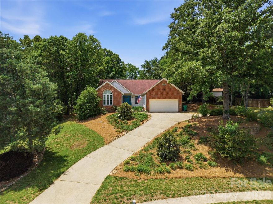 ROUGEMONT NEIGHBORHOOD!!!RARE 0.64 ACRE LOT! Don't miss the opportunity to own this 4 BR 2 BA home with one of the largest lots in the highly sought-after Rougemont community!
Perched graciously above the street, this home offers a quiet retreat with a commanding presence. While the driveway provides a natural buffer from the street, the real treasure lies behind the home as well as it's convenient Ballantyne location! Don't settle for a standard suburban lot when you can have this massive backyard footprint that's PERFECT for a future pool, organic gardens, or the ultimate play zone! An added bonus is having Ballantyne Ridge High School at your back door as well as Endhaven Elementary just around the corner! Inside the home you'll discover brand new carpet in all bedrooms, several windows have been replaced and a MASSIVE Sunrom to enjoy! Homes in this neighborhood go FAST so if you "sleep on this one" you'll never get the chance to actually sleep IN it! Hurry and schedule your showing today!