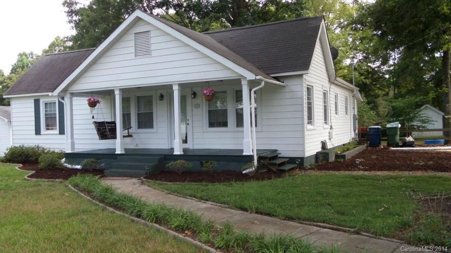 Charming bungalow style home situated close to conveniences, yet far enough away for privacy. Minutes from the airport, enjoy the covered front porch or large level back yard after a long day at work. Home has a large eat in kitchen, great laundry & pantry area, new carpets throughout, new paint & more. All living space on one floor!!! Home warranty provided.