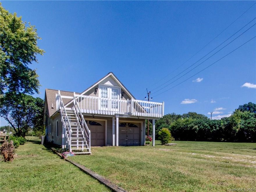 Gorgeous Clover home with a very nice and spacious yard! Completely remodeled kitchen, including new appliances, counter tops and cabinets. Updated bathrooms including new vanities, toilets, floors, mirrors and lighting. Freshly painted throughout home, new flooring downstairs and brand new carpet on stairwell/upstairs hallway. Separate attics outside and inside for extra storage space. Solar powered generators on the roof to reduce utility bills drastically. Recent termite inspection/treatment.