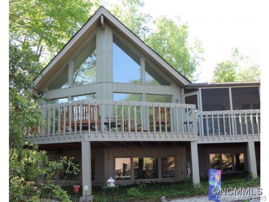 Colorful Contemporary 3BR/3.5BA Home with picture perfect Long Range Mountain View, Screen Porch, Deck, Privacy Fence, Storage Shed on private lot. Inside live on 1 level or 2 with 2 Wood-burning Stone Fireplaces, newly remodeled Kitchen, Hardwoods, Skylight, Open Floor Plan. Lots of glass brings the outside in! Lower Lever has 2 BR, Family Room, Pool Room/Hobby Room and plumbed Bar. Everything on your wish list for the Ultimate Mountain Home!