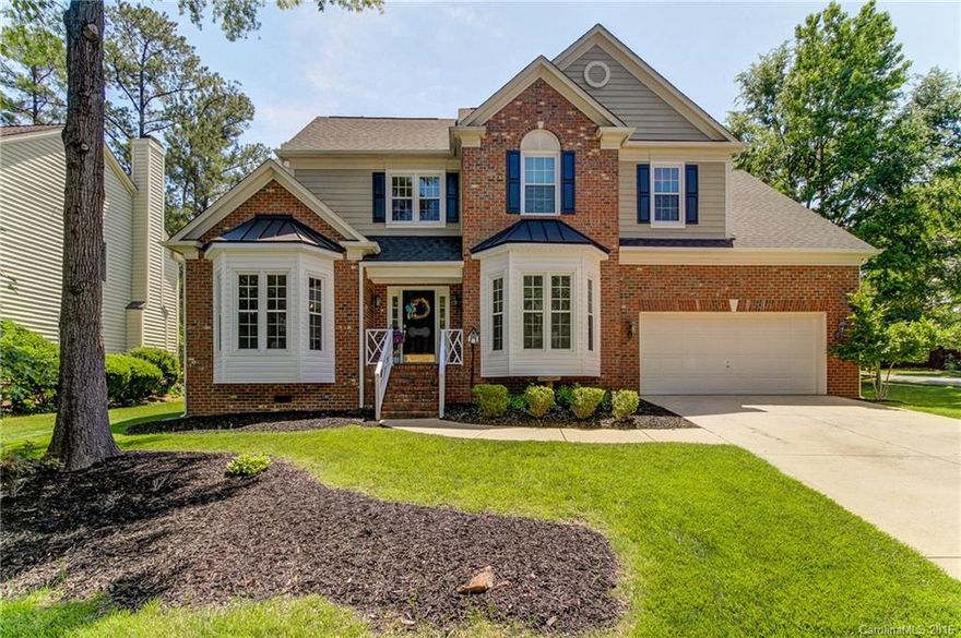 Come see this immaculately kept 4Br/2.5 BA Brick Front Home in the highly desired Highland Creek neighborhood. This home features a gourmet kitchen with SS appliances, granite counters and double oven.  Between the spacious kitchen, a cozy family room leading into a bright sunroom, with a window wall and dual fireplace overlooking a tranquil, beautifully landscaped yard, this home has the perfect floor plan for entertaining! Plenty of storage with custom built in shelves throughout the home.